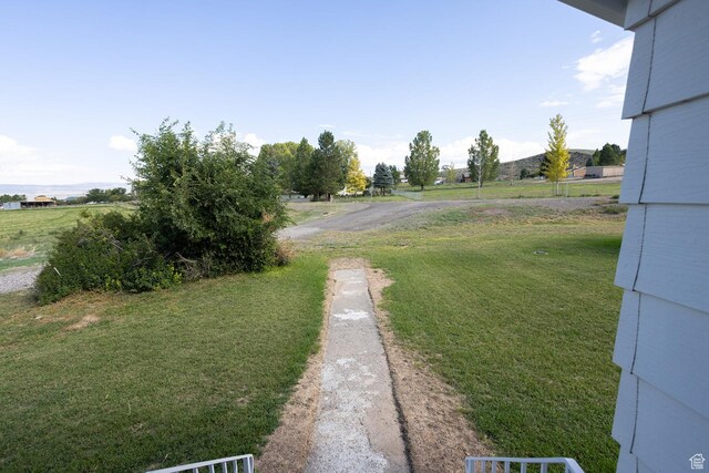 566 S Main St, Lyman, UT 84749 - view of green lawn featuring dirt driveway