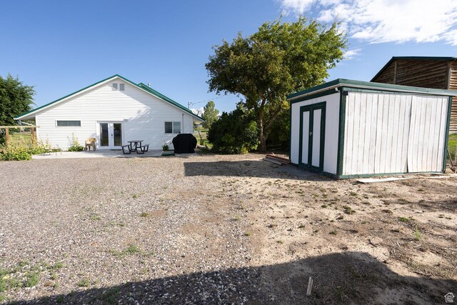 566 S Main St, Lyman, UT 84749 - rear view of house featuring french doors and a patio area