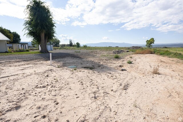 566 S Main St, Lyman, UT 84749 - view of yard featuring a mountain view