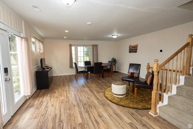 566 S Main St, Lyman, UT 84749 - living room with light wood-style flooring, ornamental molding, stairs, and baseboards