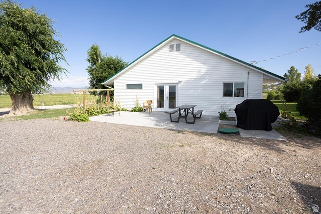 566 S Main St, Lyman, UT 84749 - rear view of house featuring french doors and a patio area