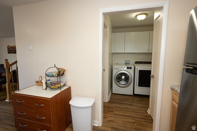 566 S Main St, Lyman, UT 84749 - washroom with washing machine and dryer, cabinet space, and dark wood finished floors