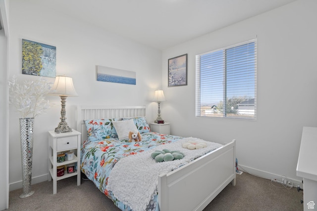 bedroom with carpet flooring and baseboards