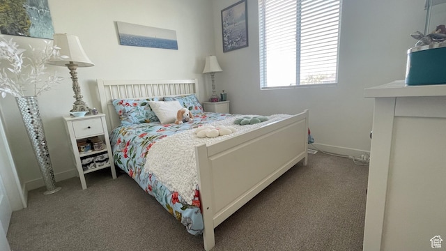 carpeted bedroom with baseboards