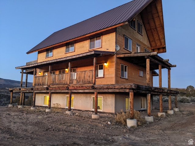 view of side of home with a balcony