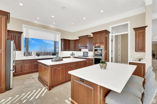 5210 Skyline Pkwy, Ogden, UT 84403 - kitchen featuring light countertops, recessed lighting, custom range hood, a kitchen island, and appliances with stainless steel finishes