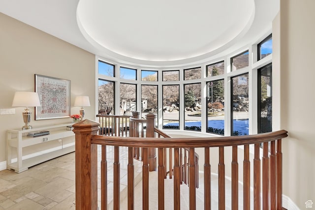 5210 Skyline Pkwy, Ogden, UT 84403 - stairs with a tray ceiling, baseboards, and stone tile floors