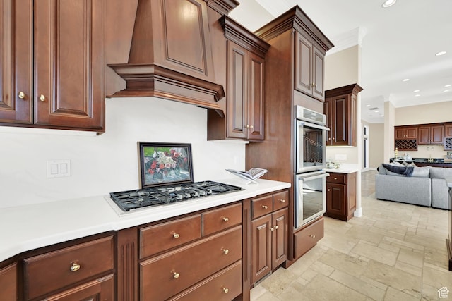 5210 Skyline Pkwy, Ogden, UT 84403 - kitchen with light countertops, stainless steel double oven, open floor plan, gas cooktop, and stone tile flooring