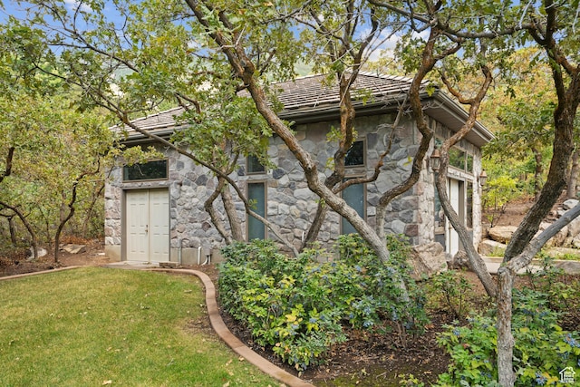5210 Skyline Pkwy, Ogden, UT 84403 - view of side of home with stone siding and a lawn