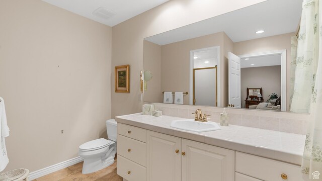 5210 Skyline Pkwy, Ogden, UT 84403 - full bath with toilet, a shower, vanity, baseboards, and recessed lighting