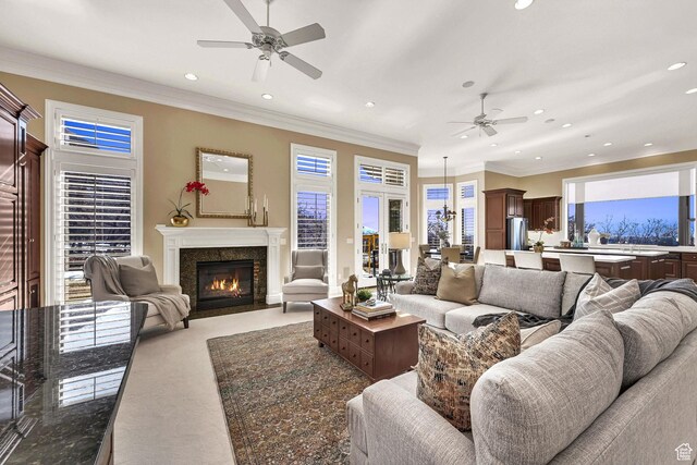 5210 Skyline Pkwy, Ogden, UT 84403 - living room with ornamental molding, a premium fireplace, recessed lighting, and a ceiling fan