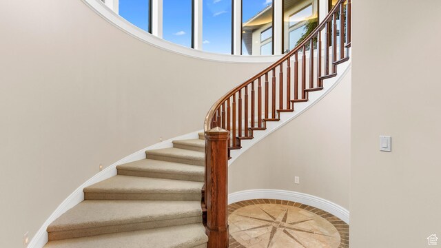 5210 Skyline Pkwy, Ogden, UT 84403 - stairs with a towering ceiling and baseboards