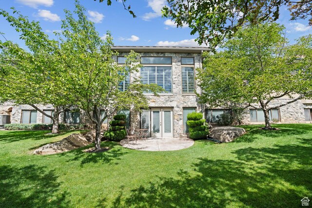 5210 Skyline Pkwy, Ogden, UT 84403 - back of property featuring stone siding, french doors, a yard, and a patio area