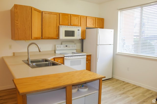 502 S 1040 E Unit 147, American Fork, UT 84003 - kitchen with white appliances, a sink, light wood finished floors, and baseboards