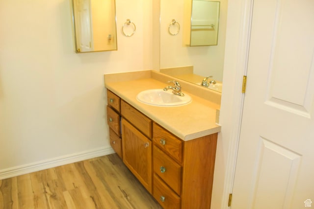 502 S 1040 E Unit 147, American Fork, UT 84003 - bathroom featuring wood finished floors, vanity, and baseboards