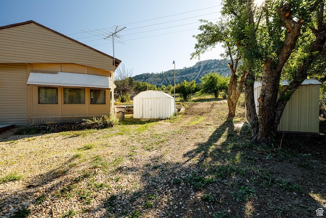 325 S Main St, Glendale, UT 84729 - view of yard with a storage unit and a mountain view