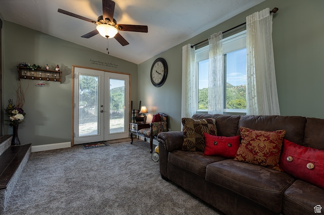 living room featuring vaulted ceiling, plenty of natural light, french doors, and ceiling fan