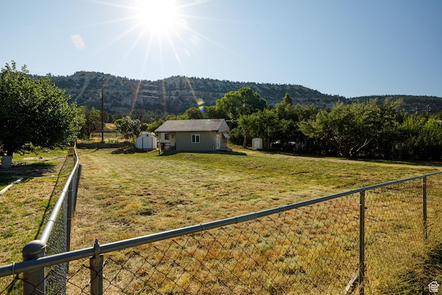 325 S Main St, Glendale, UT 84729 - fenced backyard featuring a mountain view, a shed, and a view of rural / pastoral area