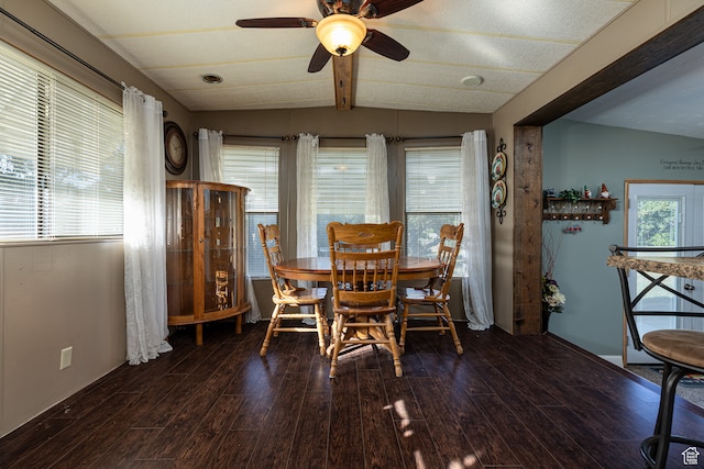 dining space with vaulted ceiling with beams, ceiling fan, and dark hardwood / wood-style floors