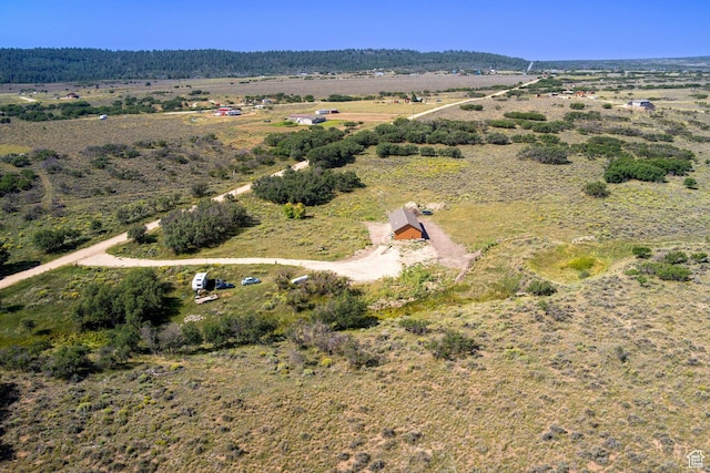 birds eye view of property featuring a rural view