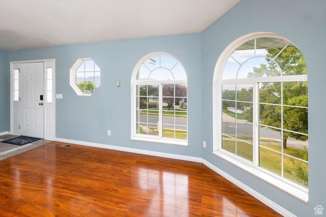 232 Bugle Way, Providence, UT 84332 - foyer featuring baseboards, visible vents, and wood finished floors