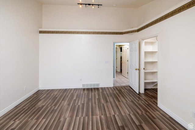 232 Bugle Way, Providence, UT 84332 - spare room with wood finished floors, baseboards, and visible vents
