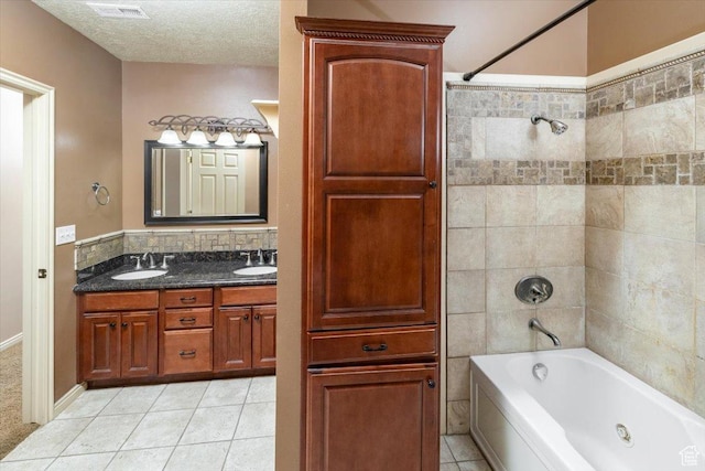 232 Bugle Way, Providence, UT 84332 - full bath with visible vents, a sink, tile patterned flooring, and shower / washtub combination