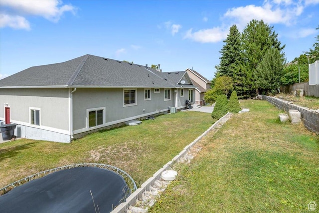 232 Bugle Way, Providence, UT 84332 - back of house featuring a lawn, a shingled roof, fence, and stucco siding