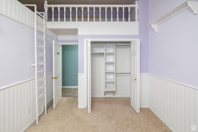 232 Bugle Way, Providence, UT 84332 - unfurnished bedroom featuring a wainscoted wall, a closet, and carpet floors