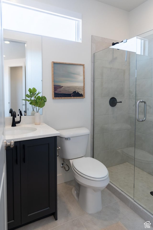 5394 S Aquamarine Ln, St George, UT 84790 - bathroom with tile patterned flooring, vanity, toilet, and walk in shower