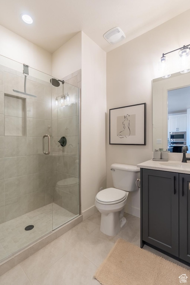 5394 S Aquamarine Ln, St George, UT 84790 - bathroom with tile patterned flooring, vanity, toilet, and walk in shower