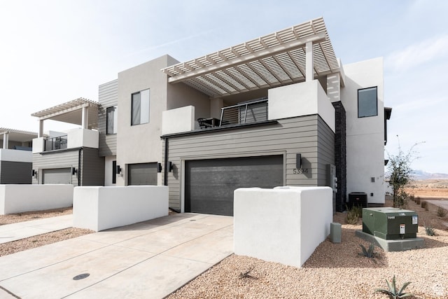 5394 S Aquamarine Ln, St George, UT 84790 - modern home featuring cooling unit, a garage, and a pergola