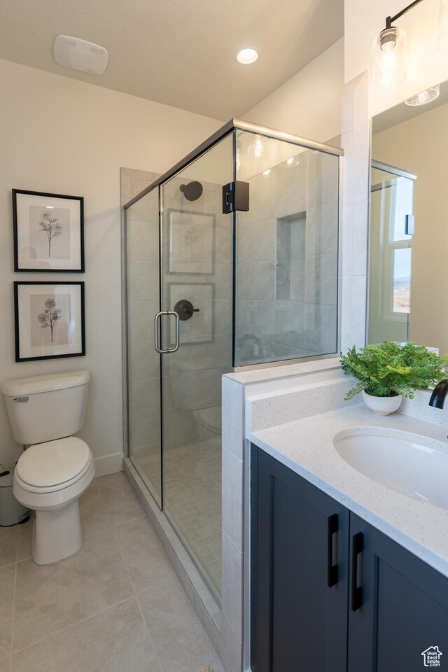 5394 S Aquamarine Ln, St George, UT 84790 - bathroom with tile patterned flooring, vanity, toilet, and a shower with door