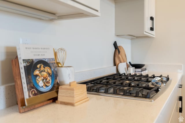 5394 S Aquamarine Ln, St George, UT 84790 - details featuring white cabinets and stainless steel gas stovetop