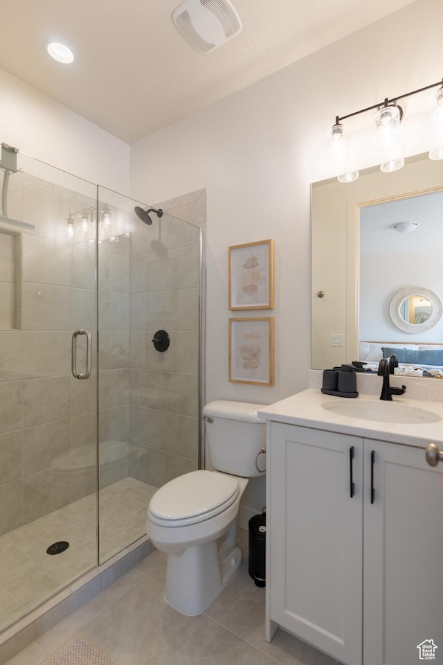 5394 S Aquamarine Ln, St George, UT 84790 - bathroom featuring tile patterned flooring, vanity, a shower with door, and toilet