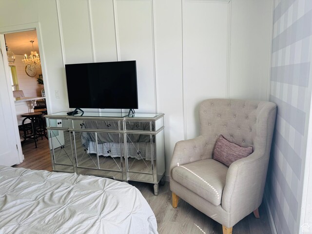 594 S Aspen Dr Unit 48, Garden City, UT 84028 - bedroom with a chandelier and wood finished floors