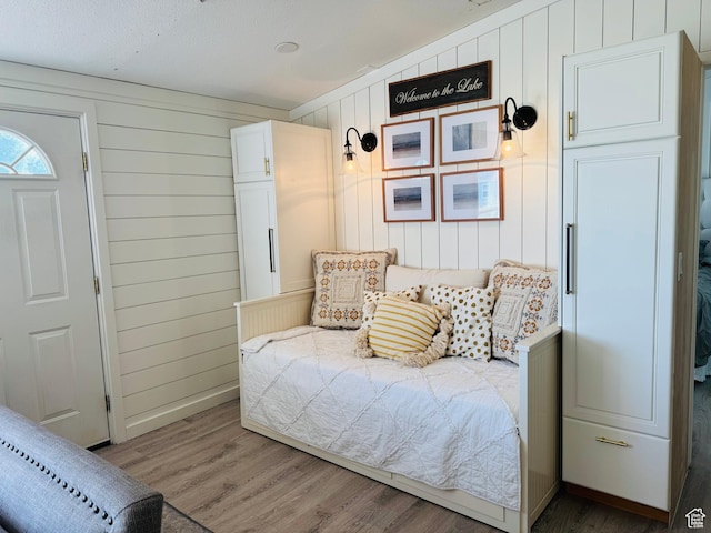 594 S Aspen Dr Unit 48, Garden City, UT 84028 - bedroom with wood finished floors and wood walls