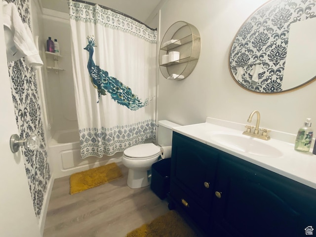 594 S Aspen Dr Unit 48, Garden City, UT 84028 - full bath featuring shower / tub combo, toilet, wood finished floors, and vanity