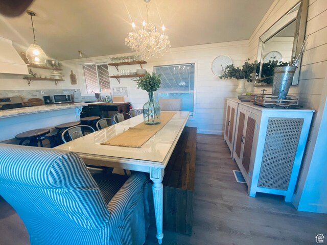 594 S Aspen Dr Unit 48, Garden City, UT 84028 - dining space featuring a notable chandelier, dark wood-type flooring, and visible vents