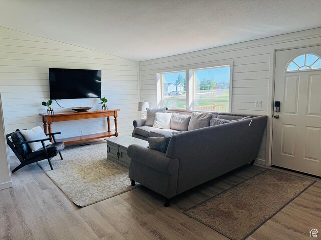 594 S Aspen Dr Unit 48, Garden City, UT 84028 - living area with wood finished floors, lofted ceiling, and wood walls