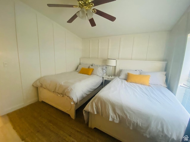 594 S Aspen Dr Unit 48, Garden City, UT 84028 - bedroom with a decorative wall, ceiling fan, and wood finished floors