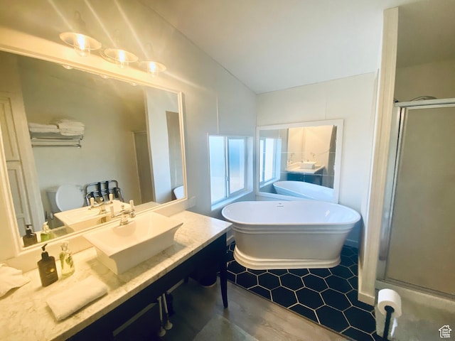 594 S Aspen Dr Unit 48, Garden City, UT 84028 - full bathroom featuring a soaking tub, a stall shower, vanity, and vaulted ceiling