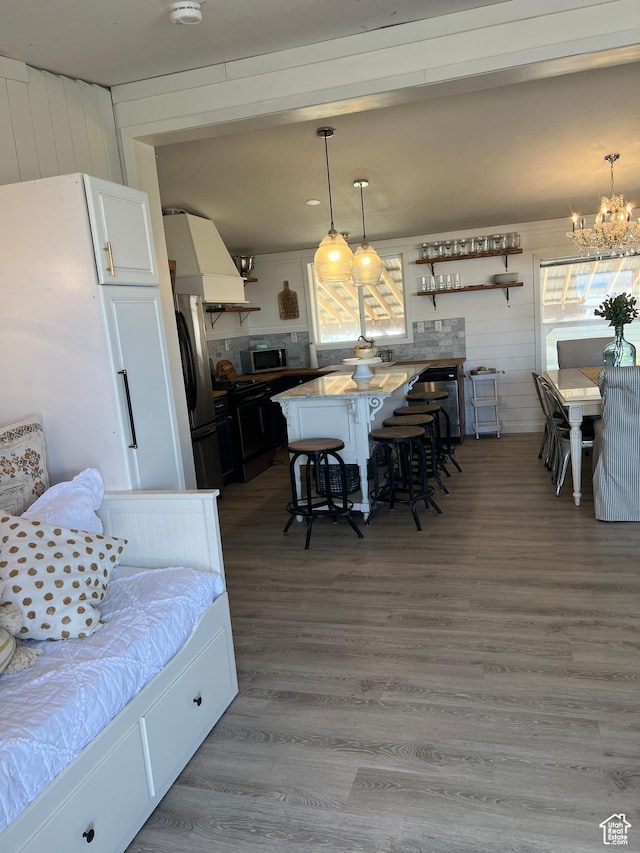 594 S Aspen Dr Unit 48, Garden City, UT 84028 - dining room with a notable chandelier and wood finished floors
