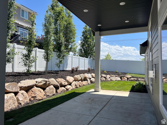 1136 N 1875 E Unit 1, Layton, UT 84040 - fenced backyard with a patio area