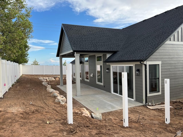 1136 N 1875 E Unit 1, Layton, UT 84040 - back of house featuring a shingled roof, a fenced backyard, and a patio area