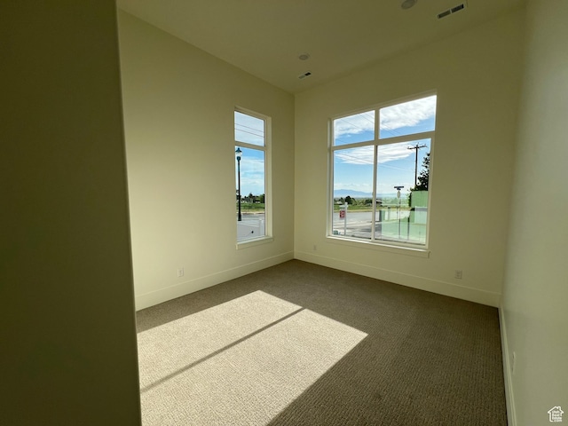 1136 N 1875 E Unit 1, Layton, UT 84040 - empty room with baseboards and dark colored carpet