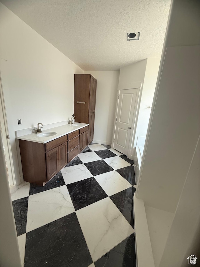 314 N 1040 E Unit 24, Salem, UT 84653 - full bath featuring a bathtub, a textured ceiling, and double vanity
