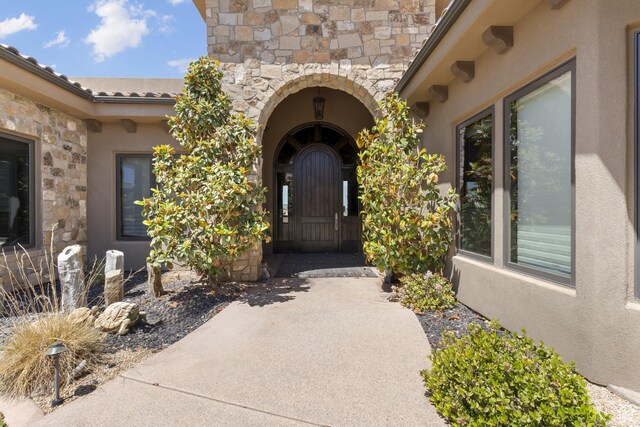 2596 E Flint St, St George, UT 84790 - view of exterior entry featuring stucco siding and stone siding