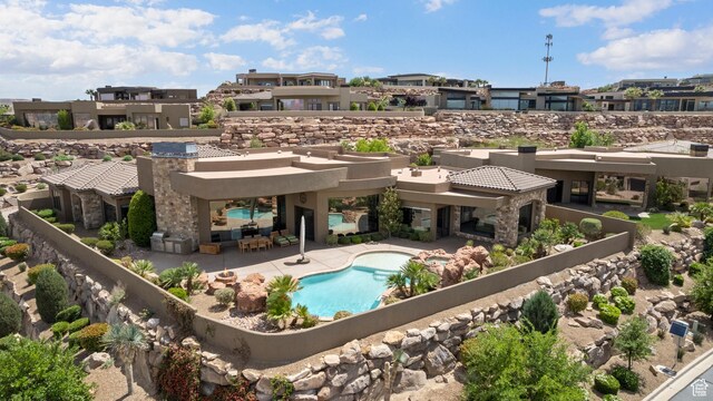 2596 E Flint St, St George, UT 84790 - exterior space featuring a patio area, a residential view, and a fenced in pool