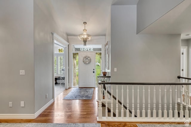 2768 W Country Classic Dr, Bluffdale, UT 84065 - foyer entrance with a chandelier, baseboards, and wood finished floors